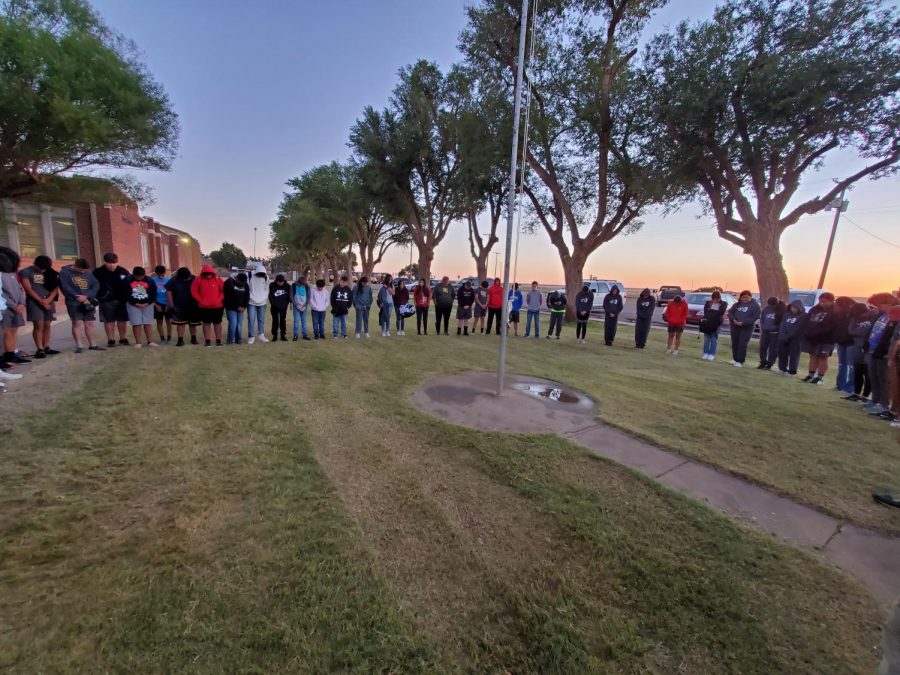 Students praying around the flag pole at See You at the Pole.
