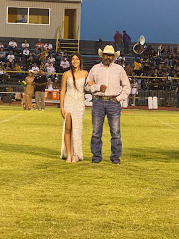 Sophomore Aryca Ibarra being escorted onto the field by father Simon Ibarra.