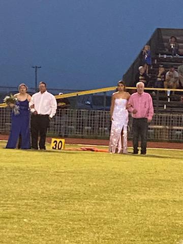 Senior homecoming candidates, Annabelle Anchondo and Katie Clayton, standing with escorts Kevin Roberts and Matt Clayton.