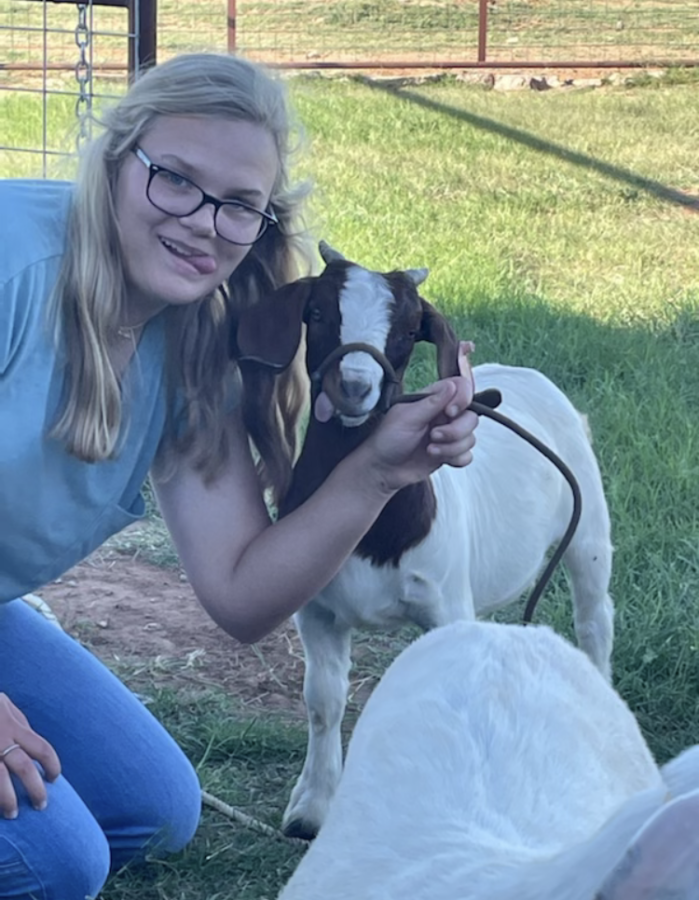 Emma with her show goat. Emma is actively involved in FFA and Ag.