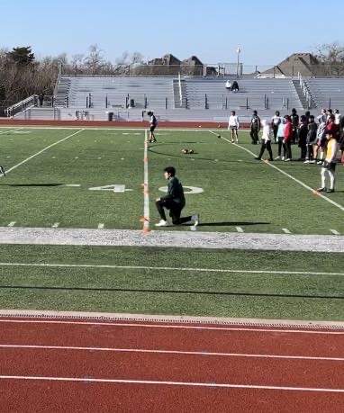 8th grader Bryan Longoria getting ready to complete drills at the Dallas football showcase. 